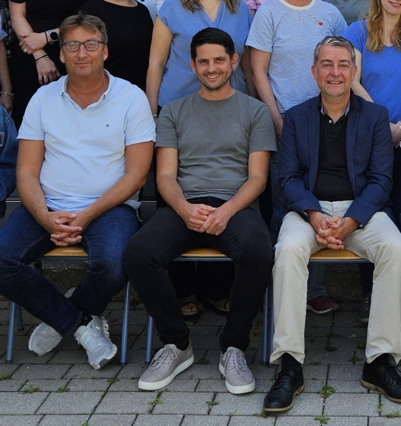Drei Herren auf dem Foto 